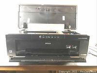 Front view of Epson Stylus Photo R2000 printer with open top lid showing the inside of the printer.