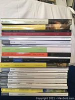 Stack of various Old Masters sale catalogs showing titles, dates, and auction houses.
