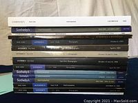 Stack of Sotheby's and Christie's photography auction catalogs showing spines with dates and locations
