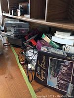 Photo showing boxed Flying Fortress software and other video game related items along with computer cables