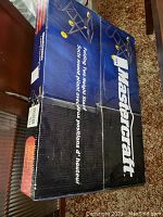 Mastercraft branded blue and black box containing the saw stand, showing branding and box condition.