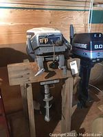 Full view of motor mounted on wooden support