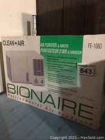 Front image of Bionaire FE-1060 air purifier box highlighting clean air branding and partial product image.