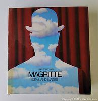 Front cover of the book showing a colorful illustration of a man wearing a bowler hat filled with clouds against a red curtain background with the title and author name.