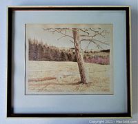Framed watercolour painting showing full frame and mat; tree and landscape visible.
