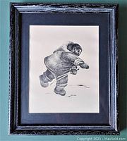 Framed pen and ink artwork showing the entire frame, matting, and glass.
