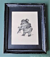 Framed pen and ink drawing showing full artwork and frame.