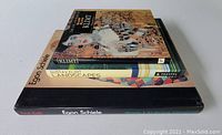 Stack of three art books showing titles and sizes, two by Gustav Klimt and one by Egon Schiele.
