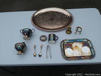 All items arranged on a blue table for display