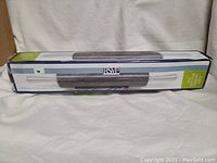 Photo of boxed grey marble rolling pin, showing packaging and item inside box.