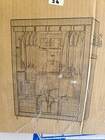 Box packaging showing illustration of UDEAR closet organizer wardrobe with multiple hanging sections and shelves.