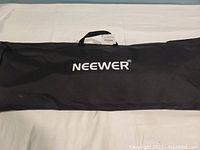 Carrying case for Neewer softbox with black fabric and white Neewer logo