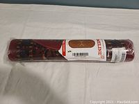 Rolled new Ottomanson Ottohome Collection rug, wrapped in original packaging with label visible.