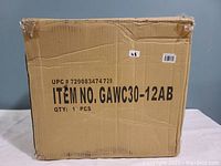 Cardboard box with item number GAWC30-12AB and UPC 729083474729, indicating original packaging for a National Tree Garden Accents watering can.