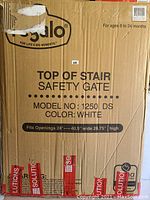 View of Regalo safety gate box showing model number, color, and size dimensions