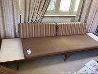 Front view of entire sofa with back cushions and end tables