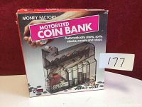Front of original Money Factory Motorized Coin Bank box showing product image, branding, and features like automatic coin sorting and counting.