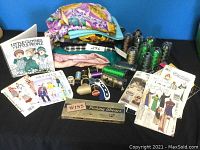 Photo showing assorted fabrics, vintage sewing patterns, spools of thread, and Wiss pinking shears