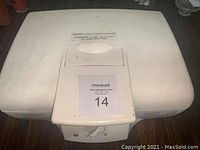 Closed Hamilton Beach electric grill showing top surface and front temperature control dial.