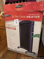 Boxed Soleus Air Micathermic Ultra Thin Heater with side control knobs visible, black unit pictorial on box.