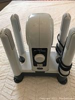 Front view of All Sport & Work electric boot dryer showing control dial and four vented shafts.