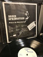 Back cover photocopy sleeve of the Bruce Springsteen unofficial live 3-record set showing black-and-white image and track listings.