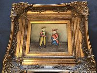 Full frontal view of painting within ornate gold frame