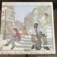Front cover of The London Sessions album featuring illustrated artwork showing Howlin' Wolf and collaborators in a London street scene.