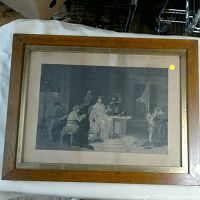 Framed black-and-white print showing the entire piece including wooden frame and matting.