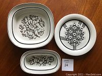 Three midcentury ceramic pieces: two Stig Lindberg serving bowls in black and white floral design and one Arabia Finland hand painted plate (10.5 inch)
