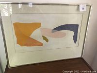 Full front view showing abstract proof in aluminum frame under glass with matting.