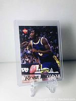 Front side of Kobe Bryant basketball card from 1998 in protective case