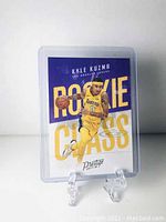 Front view of Kyle Kuzma rookie card, showing player in Lakers uniform with 'ROOKIE CLASS' text.