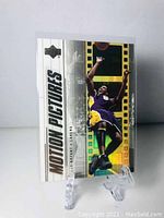 Front view of the 2002 Upper Deck Motion Pictures Kobe Bryant basketball card with image of Bryant dunking.