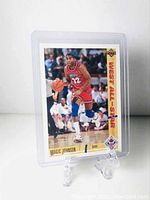 Front of the 1990-91 Upper Deck Magic Johnson West All-Star basketball card, showing Magic Johnson dribbling wearing a red uniform.