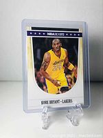Front side of the 2012 NBA Hoops Kobe Bryant basketball card in protective case