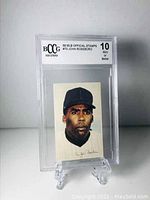Front view of 1969 John Roseboro MLB Official Stamp card graded 10 by BCCG, showing illustrated portrait and signature.