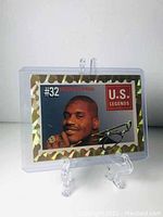 Front view of Shaquille O'Neal U.S. Legends Gold Rookie Promo Card encased in plastic holder on display stand.