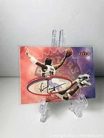 Front side of the Vince Carter basketball card showing action photo and printed facsimile signature.
