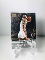 Front view of LeBron James basketball card from 2008-09 Upper Deck First Edition series showing LeBron dunking in Cavaliers uniform.