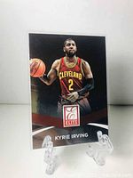 Front of 2014-2015 Panini Elite Kyrie Irving basketball card with player image in Cleveland Cavaliers uniform, card number 25.