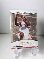 Front view of the 2007-08 Stat Tracker LeBron James basketball card showing LeBron James in Cavaliers white jersey number 23.