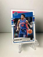 Front of Saddiq Bey rookie card showing player in action and Rated Rookie logo.
