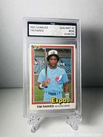 Front side of 1981 Donruss Tim Raines baseball card graded GEM MINT 10 in plastic slab displayed on stand.