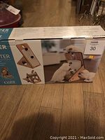 Boxed Vesper Play Centre showing assembled product with cats interacting with it and three views of the play centre's features