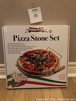 Photo of unopened Kitchen Worthy Pizza Stone Set box showing product image and branding.
