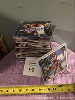 Stack of several CDs with visible 'Footloose' and 'Reggae 2009' covers showing lot's content