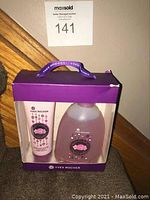 Full view of the unopened gift box showing both items: hand cream tube and liquid hand soap bottle.