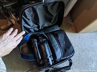 Sony Video 8 Handycam and case packed in a black carrying bag showing the strap and compartments.