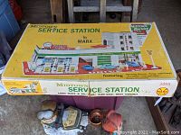 Original box of Marx Midtown Service Station set showing box art with service station illustration, model number 3495, and branding.